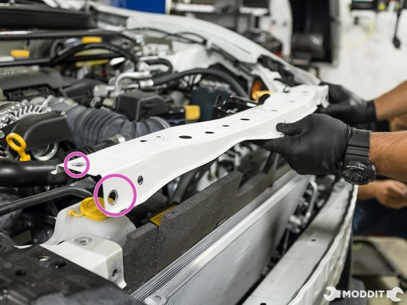 Hint: The two bolts are located near the header.