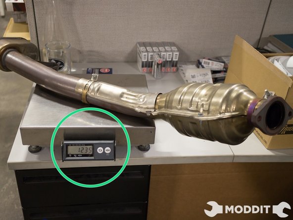 So in comparison, the Stock Front Pipe was WAY heavier than the Tomei Titanium front pipe.  The gains from the cat removal and the weight loss will definitely make a noticeable difference in performance.