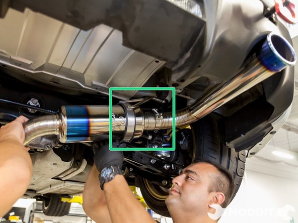 Use some sort of WD-40 or PB Blaster to lube the hangers and then wrap the muffler itself with the provided hanger from Tomei.