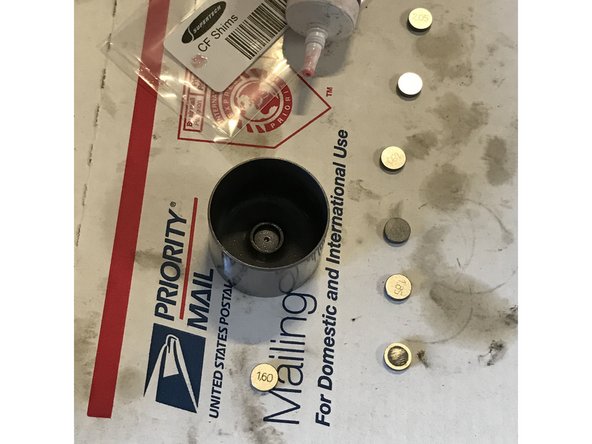 Each cam lobe has a bucket and shim above the valve. Remove each shim thickness individually and record your findings. Place shim back in its original location. These numbers will be important.