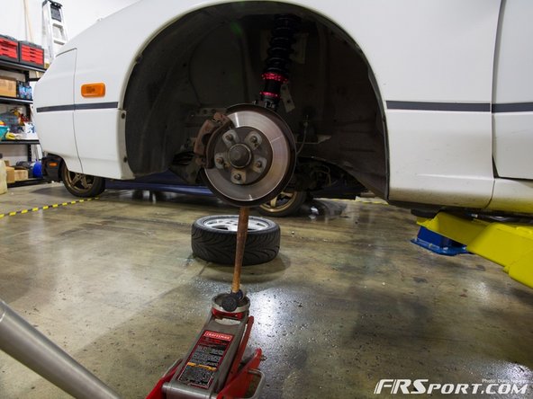 Put the studs through the top 3 holes and tighten the nuts hand tight.