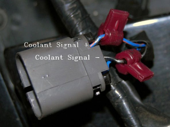 Connect the negative wires of the fan motors to the two large white negative wires coming from the fan controller.