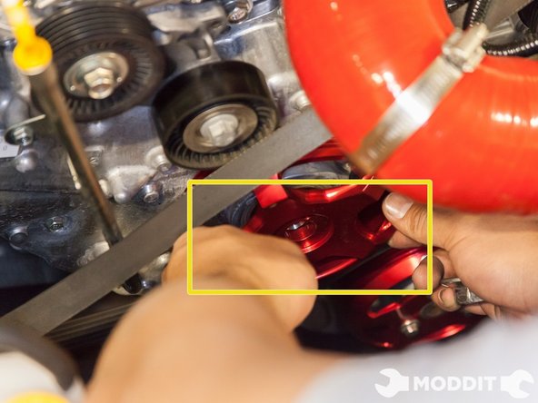 Take the o-ring from the factory pulley and install it on to the crank pulley.