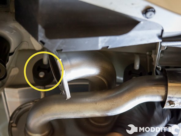 Remove the two exhaust bushing closest to the rear of the car first so the exhaust tips do not swing up and hit your bumper.