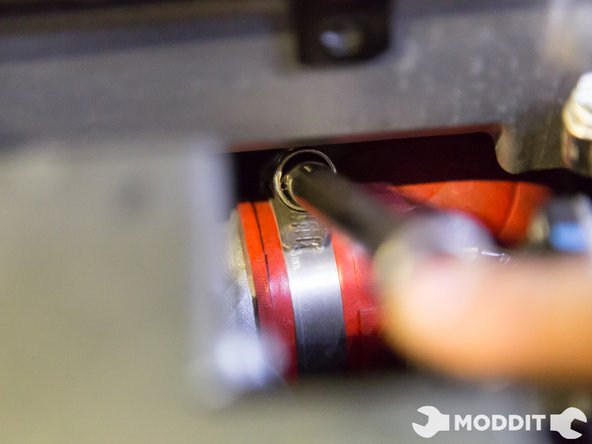 Using a flat head screw driver carefully loosen the couplers