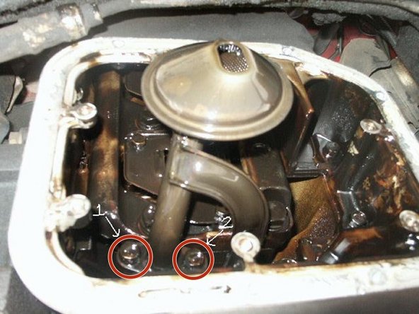 Remove the two bolts shown in the picture using a 12mm socket.