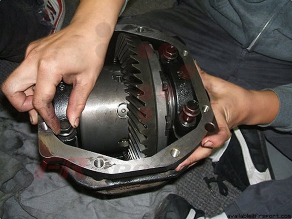 Put in the new differential, along with the new spacers provided with the new differential, and your ring spacer you saved previously.