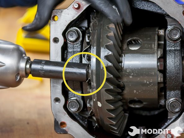 Try to use various angles to achieve flattening all the locking tabs just enough to let you use your tool of choice. We were using an extended 17mm Socket and impact gun for quick removal.  You will not be using these locking tabs again.
