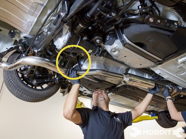 While supporting the front of the exhaust, install the hanger bushing.