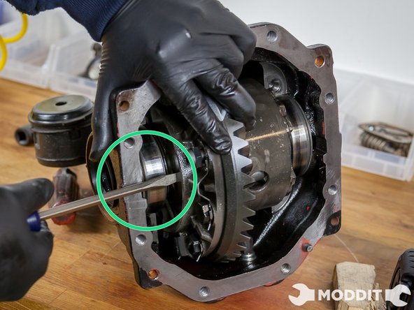 Once the metal side retainers are out of the way you are clear to start removing the actual Differential Mechanism. Be prepared for a fight as this step requires some force.