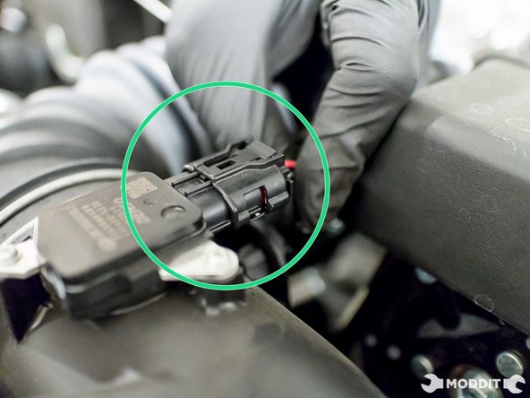 Note: Be sure to not damage the factory air flow sensor because it will be brought over to the new air intake.