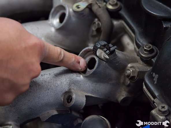 Start the install by cleaning the area where the old injector seats were.