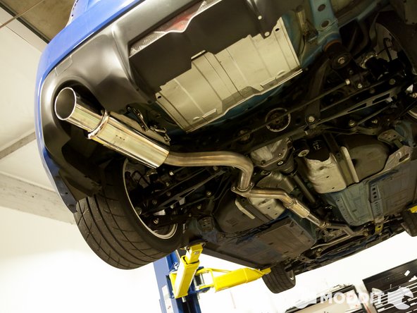 Its almost done! At this point the exhaust system is on. Sometimes the muffler looks a little skewed or not centered. If left the bolts loose on the mid-pipe and axle back, go ahead and position the exhaust in the desired orientation