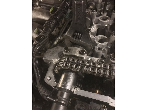 Place the 1&quot; wrench on the camshaft and loosen the cam gear with a 24mm socket.