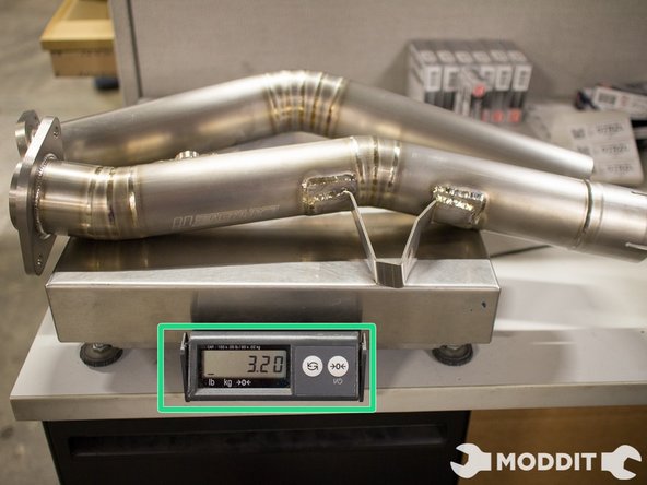 So in comparison, the Stock Front Pipe was WAY heavier than the Tomei Titanium front pipe.  The gains from the cat removal and the weight loss will definitely make a noticeable difference in performance.