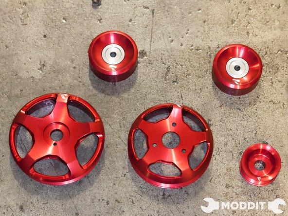 The removal of the stock idlers is not necessary for the S1 kit. Since we are installing the S2 kit, we have to remove the stock idler pulleys.