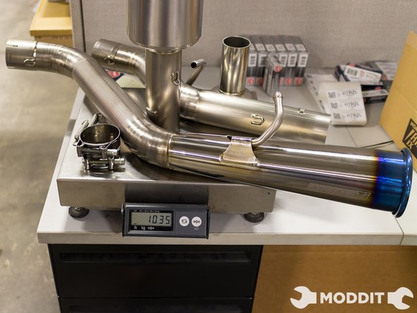 After the exhaust is tight, wipe off any excess oils or lubrication off of the exhaust, to give it a cleaner look.