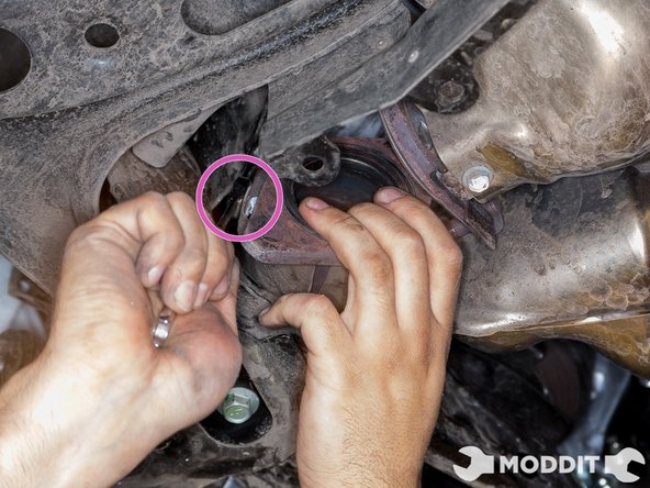 Remove the four 10mm bolts and one 10mm nut securing the heat shield to the overpipe. Remove the heat shields.