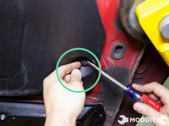 Here you can see that a flat head screw driver will also work just as well to remove the plastic clips in the underside.