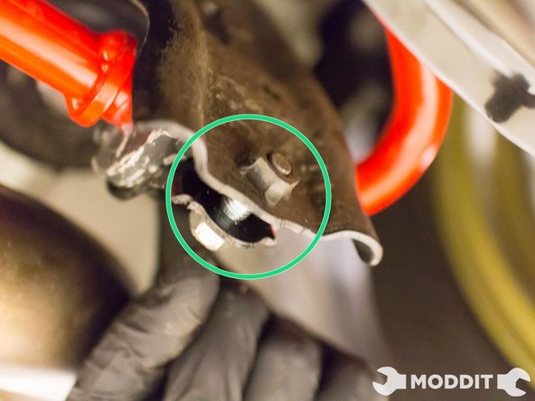 Begin by threading in the lower bolt to the sway bar bracket so that the hold mechanism is held tight.