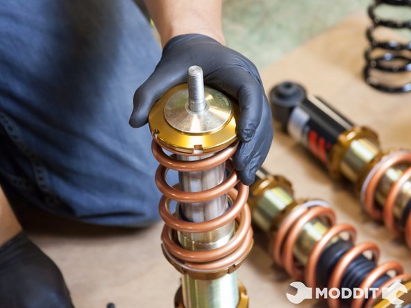 Upon reassembly, we tightened the collars back on until there was no play in the springs, then we tightened it one more turn. There are different preferences in setting preload so feel free to set it to your preferred setting.