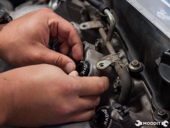 Proceed to lube and press in the injector seats into the intake manifold.