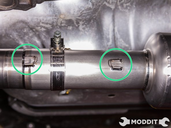 Then once again, line up the spring hooks.