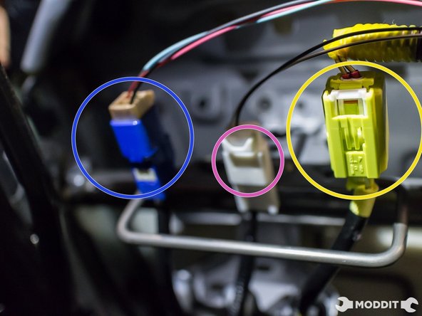 Tilt seat to expose the three connectors hidden under a small flap of carpet.