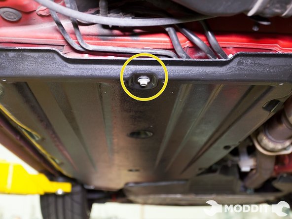 Next Secure a rear most section of the Central/Left under tray with a bolt to prevent it from falling and allowing you to fasten the rest of the clips and bolts.