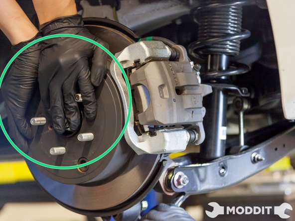 If you are doing this by yourself, then the removal of the link is a must. As you can see in the image, we succeeded in forcing it out, but it was way easier when we took off the sway bar link on the other side.