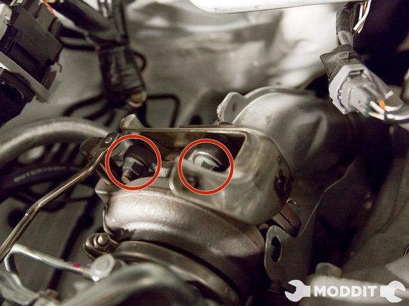 Loosen bolts on the downpipe.