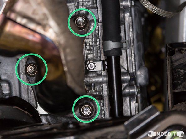 While supporting the header, loosen the 3 nuts holding the left side of the header to the head. (Loosen the nuts slowly on the left side of the header). Make sure to support he left side of the header. Do not allow it to sag.