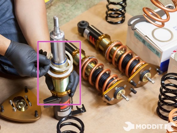 Included with the coilovers are these metal and plastic washers to help the springs seat better and reduce binding. Make sure you leave the metal wahser closest to the spring followed by the plastic one. The combination of these two washers allow for the proper movement of the spring.