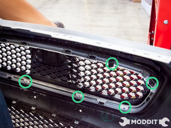 After admiring the two grilles side by side, go ahead and install the new JDM spec grille into the bumper.