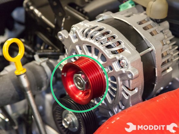 Put blue thread locker on the threads of the alternator and thread on the nut for the pulley.