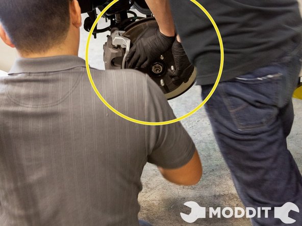 We decided to use a pry bar and pried from the front of the lower control arm through to the sway bar.