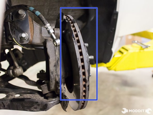 With the caliper bracket removed, detach the brake rotor.