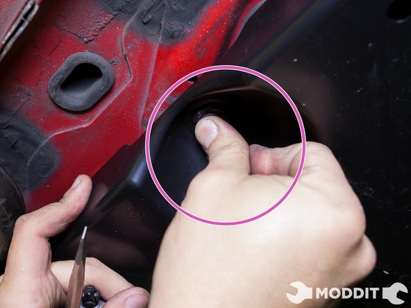 Continue to press and lock the remaining fasteners around the new, right-side Fuel Tank under tray.