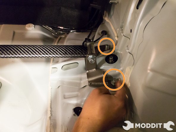 Once the bar is settled in, go ahead and carefully thread on the nuts on the strut mounts.