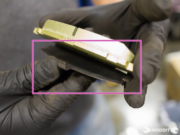 Install Factory Shims on to new pads. Shims will serve as an insulator between the piston and the new pad.