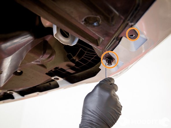 Then under the car, there are a series of clips that connect the bumper to the under tray. Pop those out as well with the small pick or screw driver.