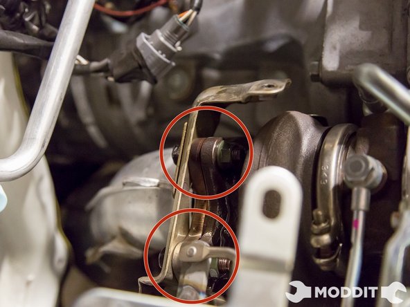 Do not remove the All bolts yet; it is easier to remove the heat shields underneath the vehicle when the downpipe is loose. You can leave 2 or 3 on the pipe