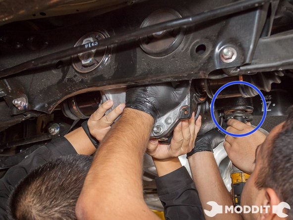 Proceed to remove the left bolt holding up the differential ear.