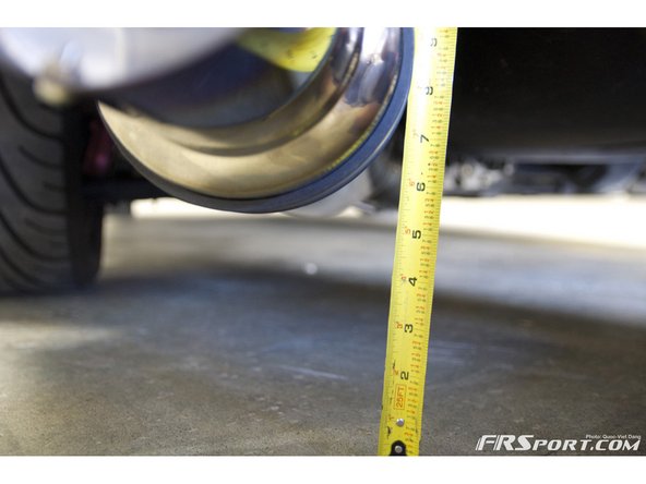 The Tomei exhaust has approximately 5&quot; ground clearance at the bottom of the rear muffler.