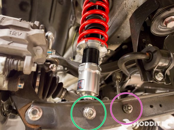 Once the coilover is in the control arm and threaded on in the shock tower, you can start tightening down the bolts.