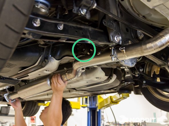 After the axle back has been snugged in, it is now time to hang the mid pipe on the hangers.