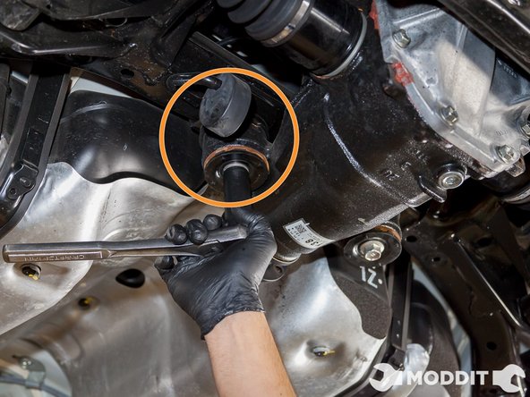 The Last bolts we need to remove are the two frontal Differential &quot;Ear&quot; Bolts. This is where your friends or tranny jack come in