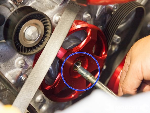 Then line up the crank pulley to the keyway and hand tighten the bolt with the thread locker on the threads into place.