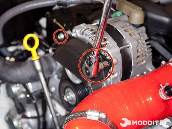 With a 10mm socket or wrench, remove the alternator cover before attempting to remove the alternator pulley bolt.