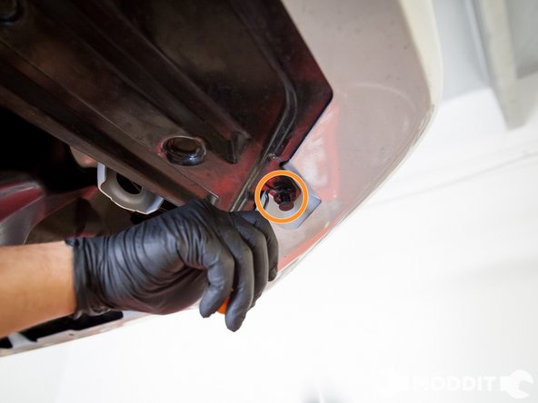 Then under the car, there are a series of clips that connect the bumper to the under tray. Pop those out as well with the small pick or screw driver.